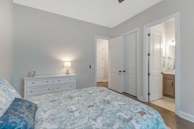 a bathroom with a double vanity sink toilet and shower