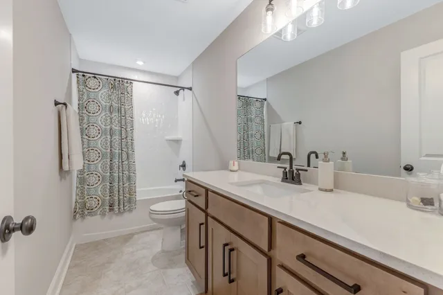 a living room with furniture a window and gym equipment