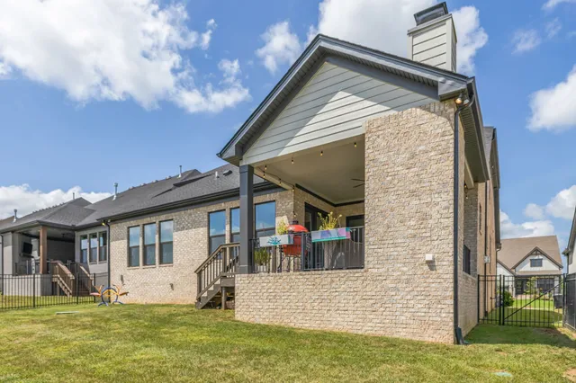 an aerial view of a house with ocean view