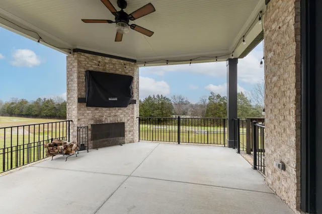 a front view of a house with a garden and yard