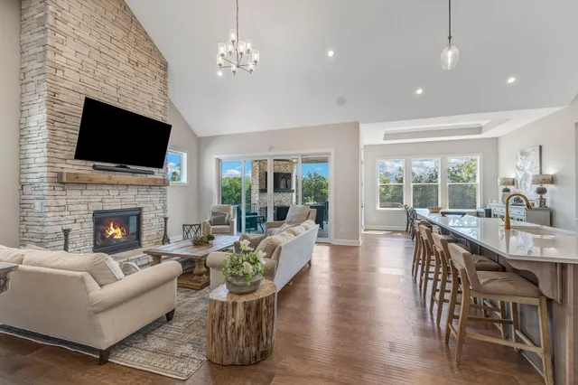 a living room with furniture fireplace and a flat screen tv