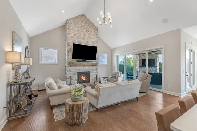 a living room with furniture fireplace and a flat screen tv