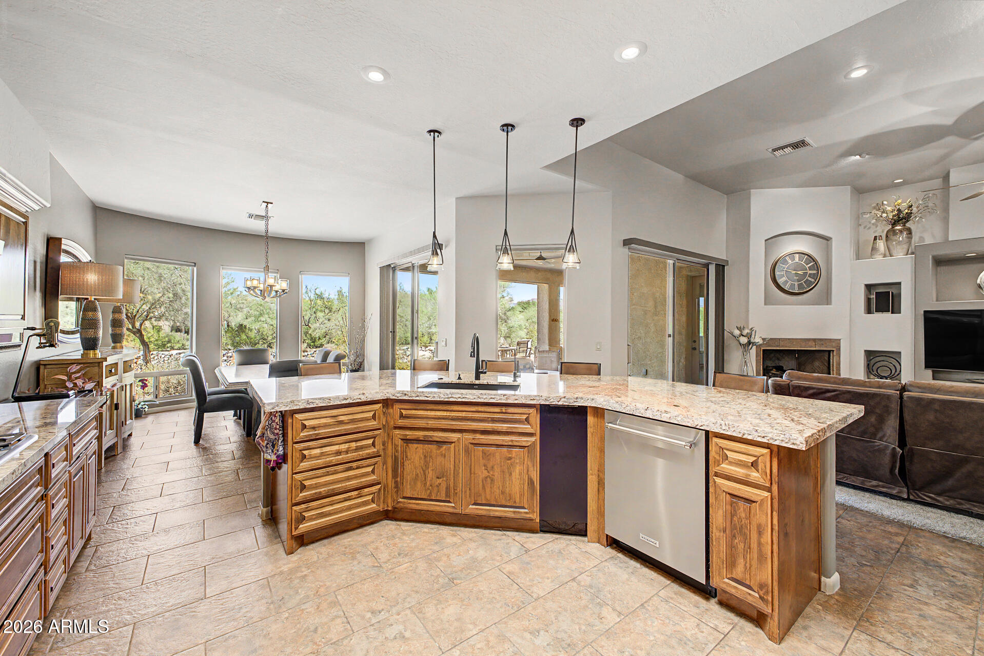 a large kitchen with lots of counter space and sink