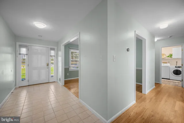 a view of hallway with wooden floor