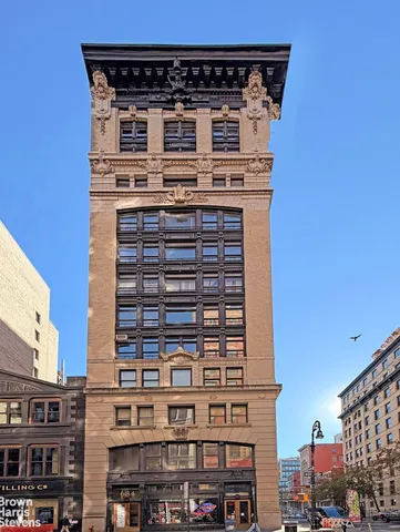 a large building with a clock on the top