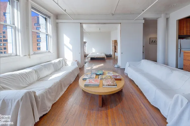 a living room with furniture and a table