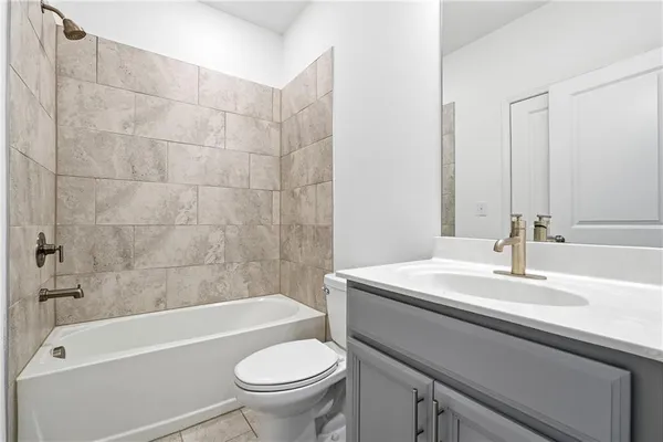 a bathroom with a sink a toilet and a bathtub