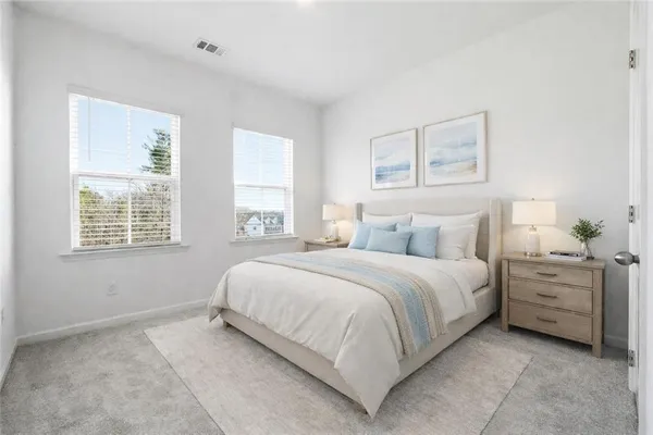 a bedroom with bed and window