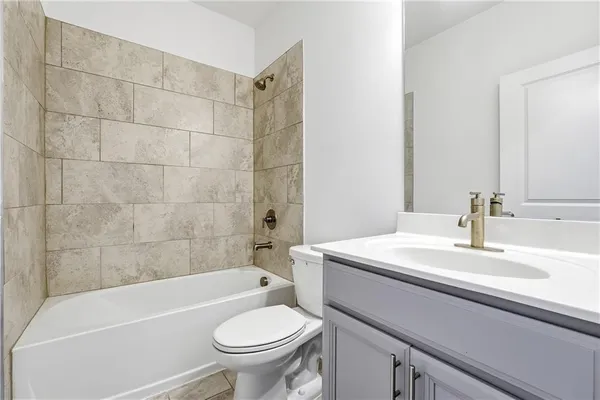 a bathroom with a sink a toilet and a bathtub