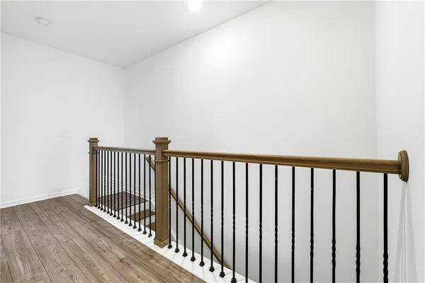 a view of a balcony with wooden floor
