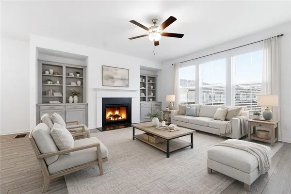 a living room with furniture and a fireplace