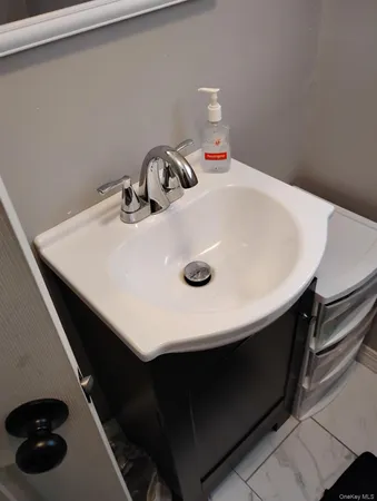 a kitchen with a sink a stove and cabinets
