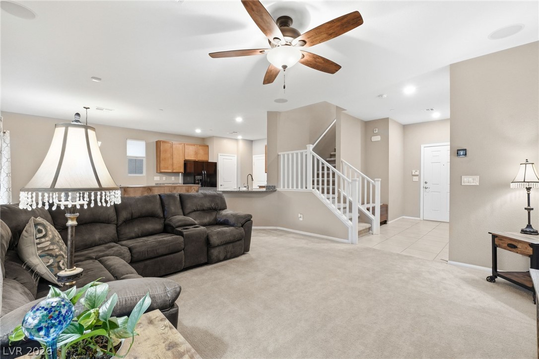 150 Fulgora Street Henderson, NV 89074 - Photo 33 of 92 Living area with ceiling fan, light carpet, and recessed lighting