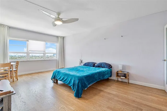 a bathroom with a sink vanity granite toilet and a shower