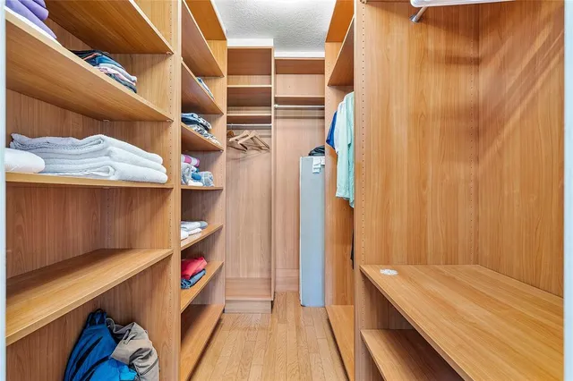 a bedroom with a large bed and a large window