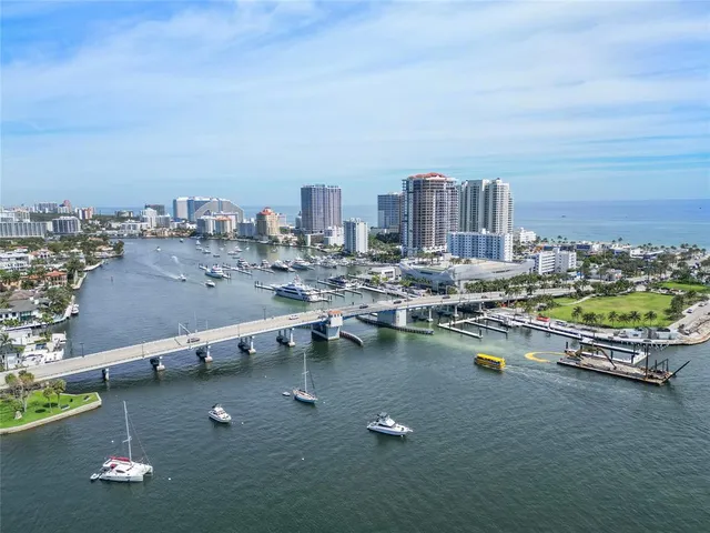 an aerial view of a house with swimming pool outdoor seating and yard