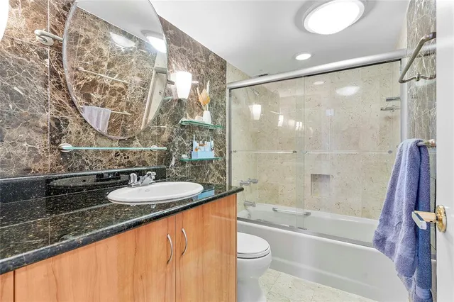 a view of swimming pool with outdoor seating and plants