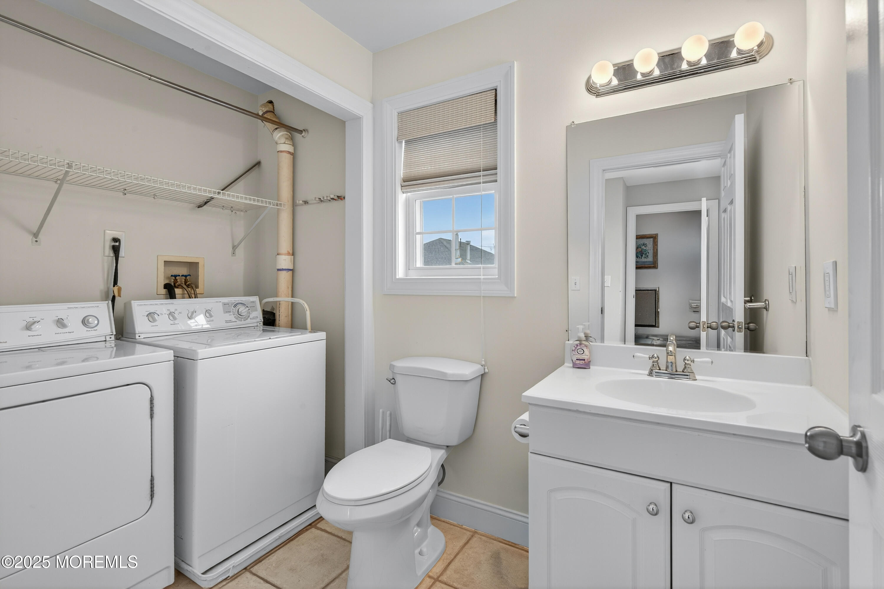 A19 Haddonfield Avenue Lavallette, NJ 08735 - Photo 20 of 24 a bathroom with a toilet sink and mirror