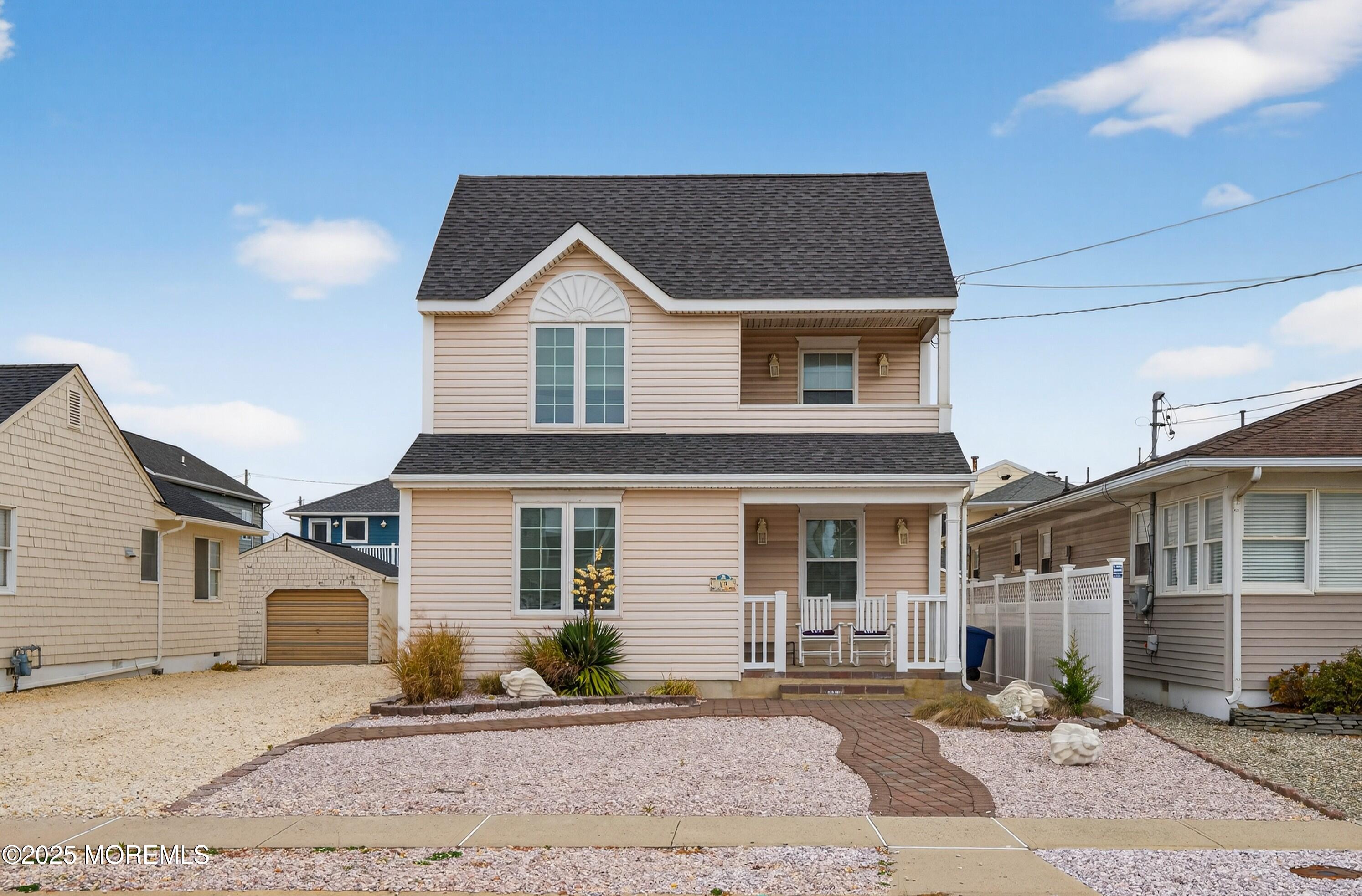 A19 Haddonfield Avenue Lavallette, NJ 08735 - Photo 2 of 24 a front view of a house with a yard