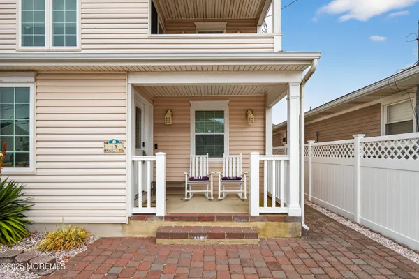 a view of a house with a door and a chair