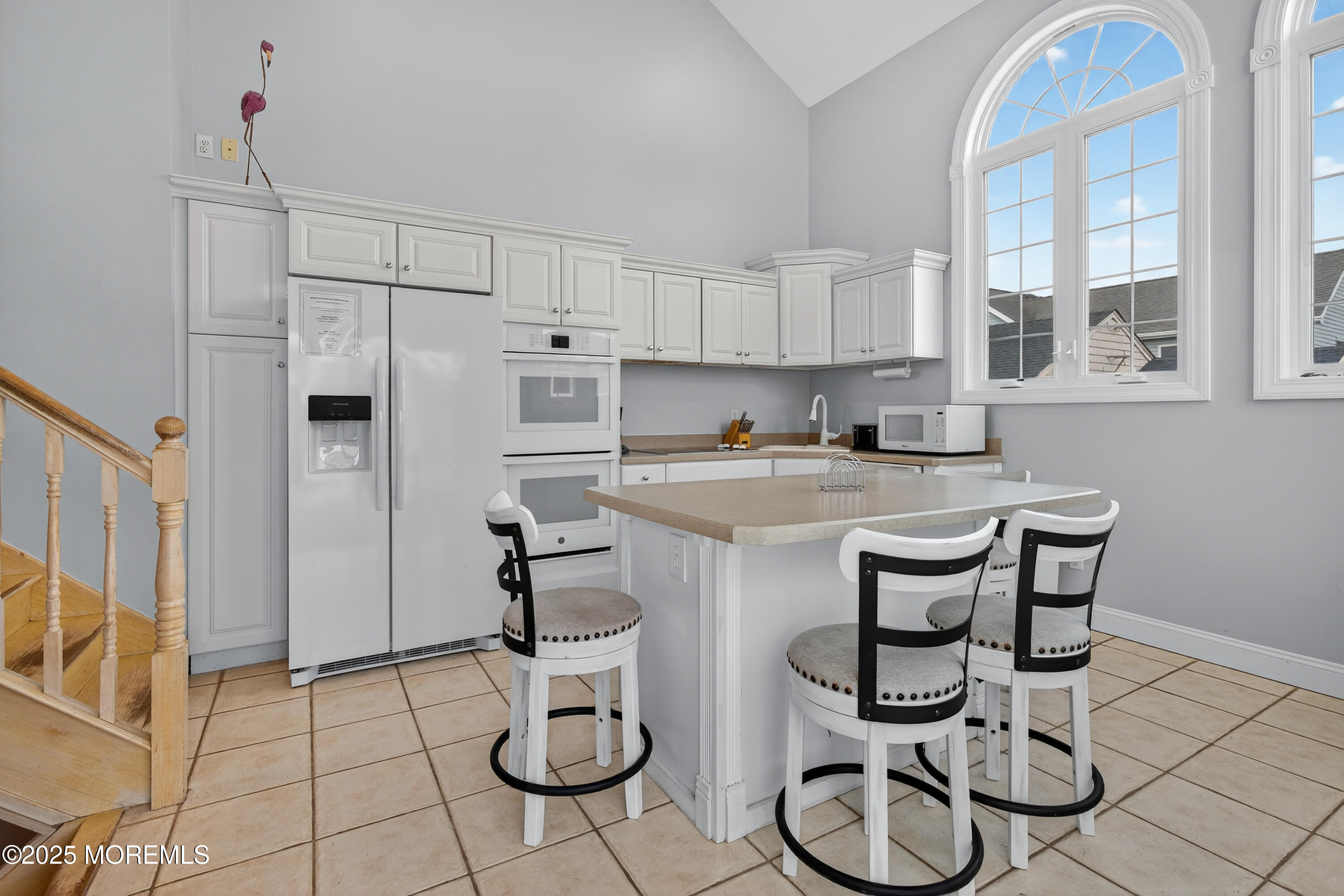 A19 Haddonfield Avenue Lavallette, NJ 08735 - Photo 6 of 24 a kitchen with stainless steel appliances kitchen island granite countertop a sink cabinets and glass door