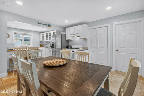 a kitchen with a table and chairs in it