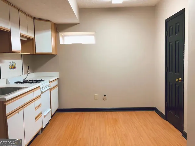 a kitchen with a sink and cabinets