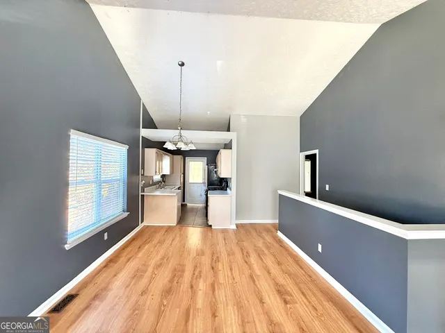 a view of a living room with a large window