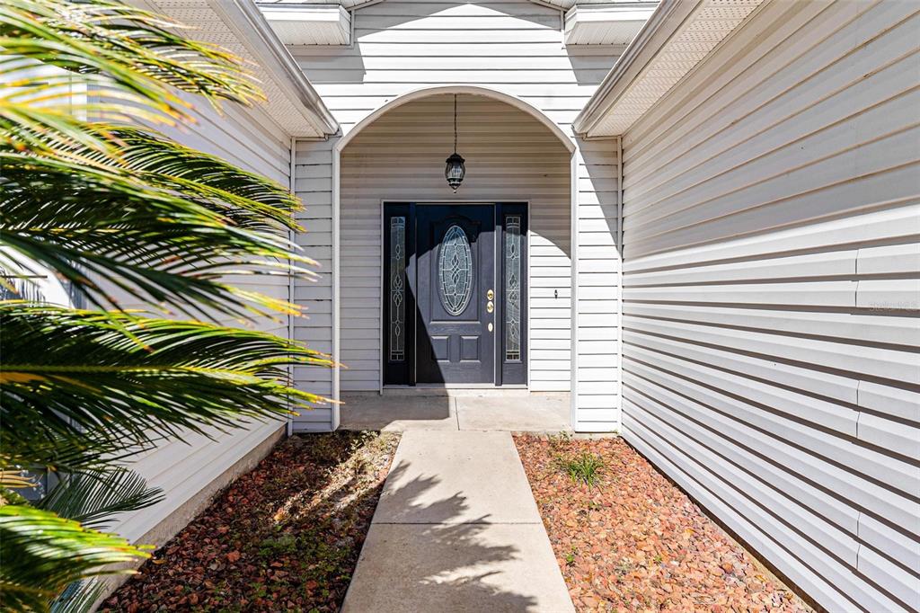 1009 Forest Breeze Path Leesburg, FL 34748 - Photo 2 of 28 a view of a entryway of the house