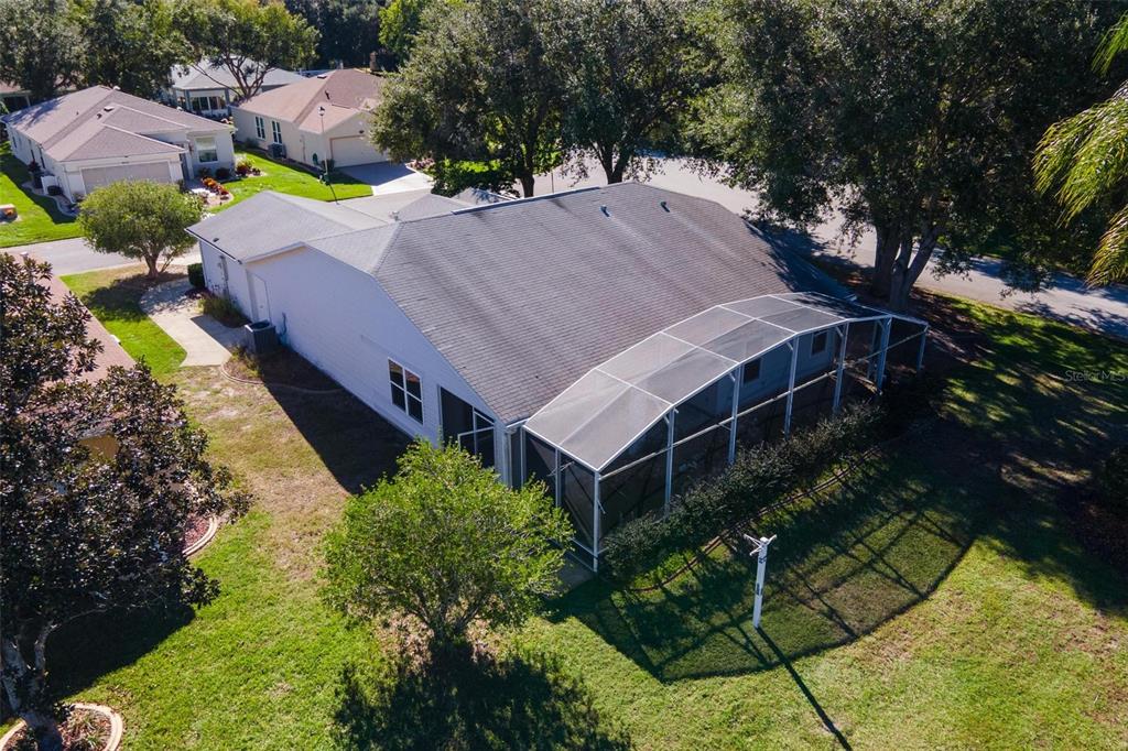 1009 Forest Breeze Path Leesburg, FL 34748 - Photo 28 of 28 an aerial view of a house with a yard basket ball court and outdoor seating
