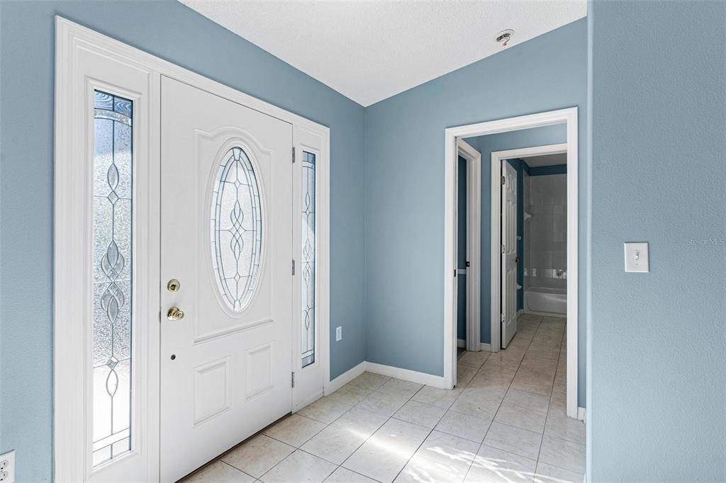 1009 Forest Breeze Path Leesburg, FL 34748 - Photo 3 of 28 a view of a hallway with closet area