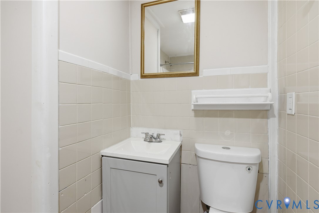 116 Fairfax Avenue Colonial Heights, VA 23834 - Photo 12 of 20 Bathroom featuring vanity and tile walls