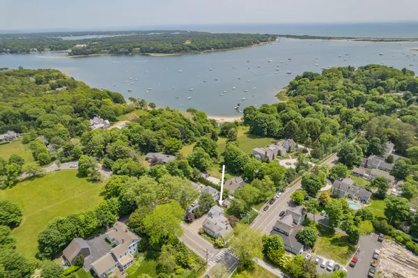 an aerial view of a houses with a lake view