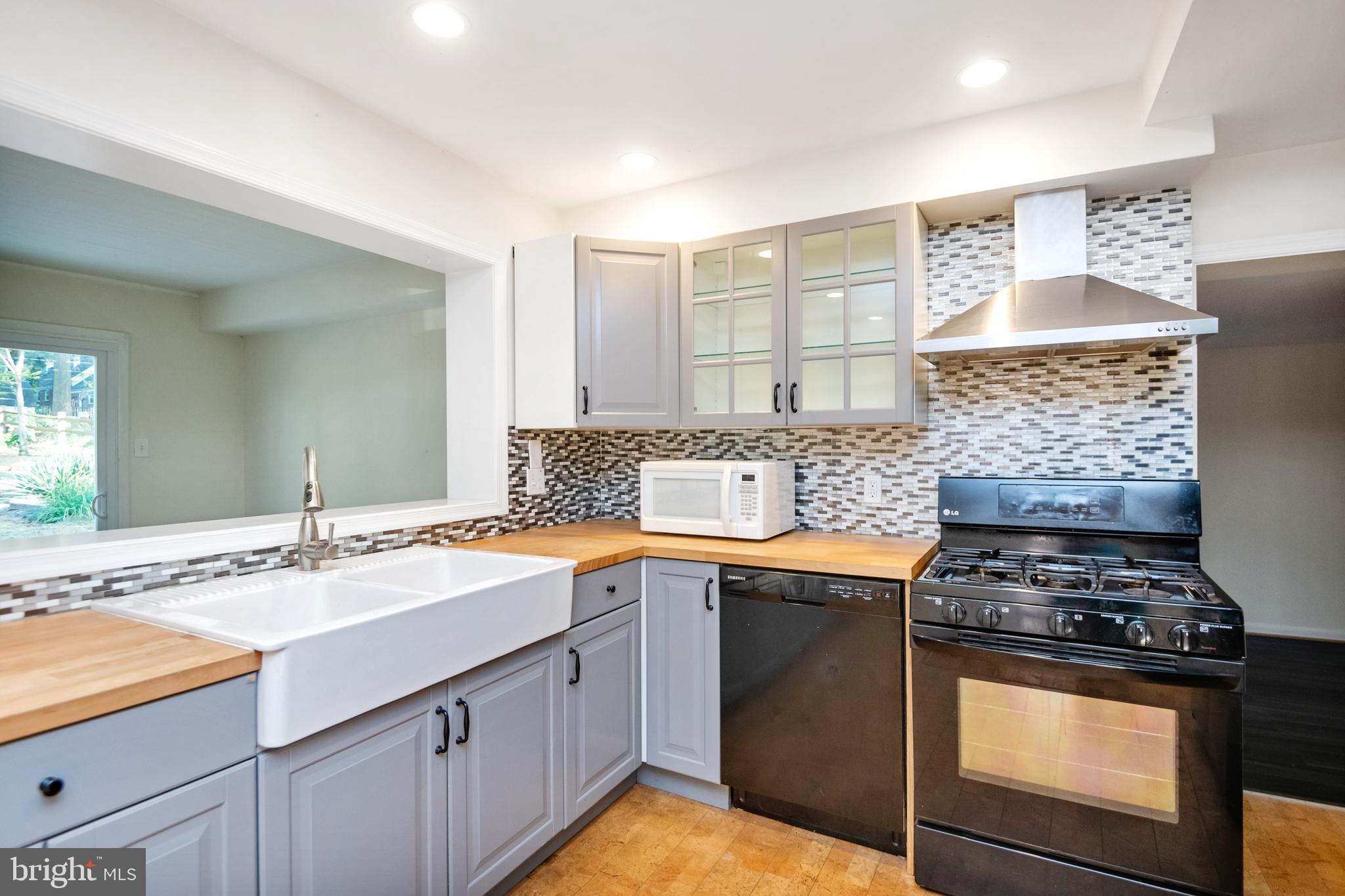 805 Olmstead Road Baltimore, MD 21208 - Photo 12 of 38 Farm double sink and gas stove range with hood