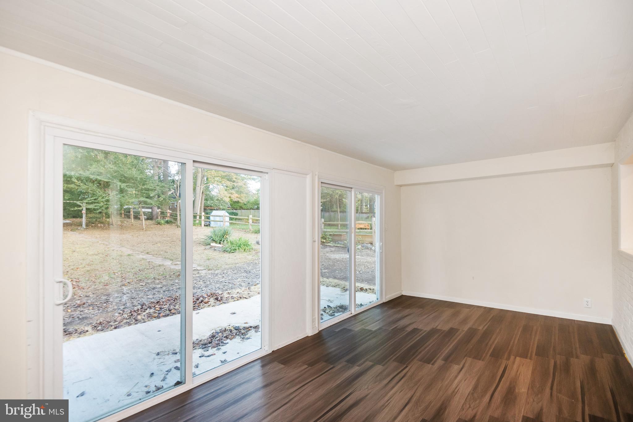 805 Olmstead Road Baltimore, MD 21208 - Photo 15 of 38 Sunroom with two sliding glass doors
