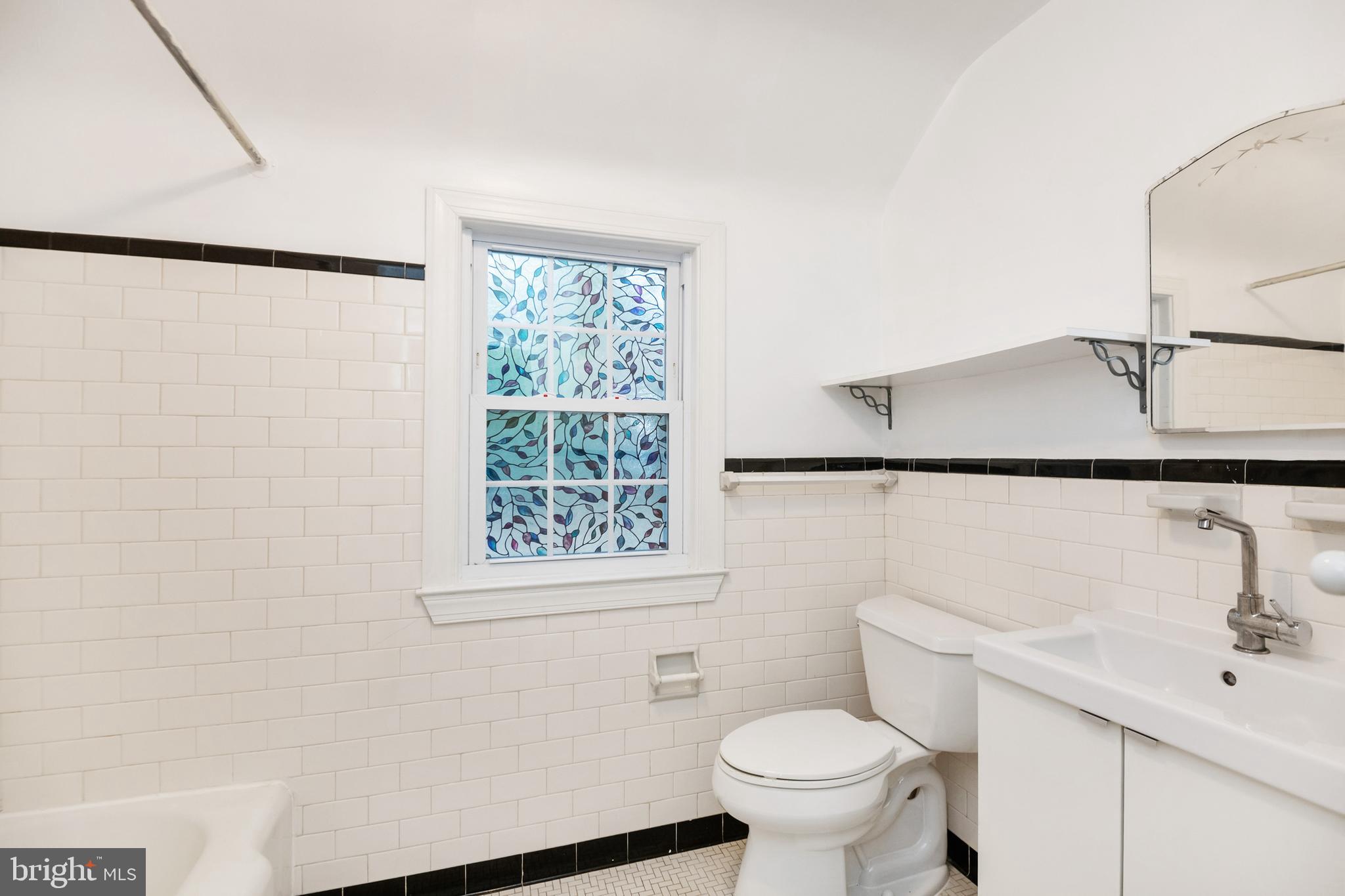 805 Olmstead Road Baltimore, MD 21208 - Photo 25 of 38 Hall full bath with original black and white tile