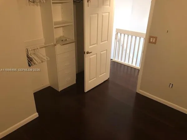an entryway of a house with wooden floor