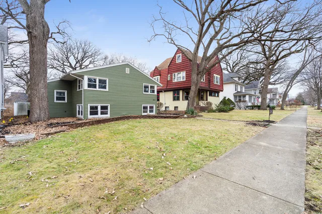 a front view of a building with a yard