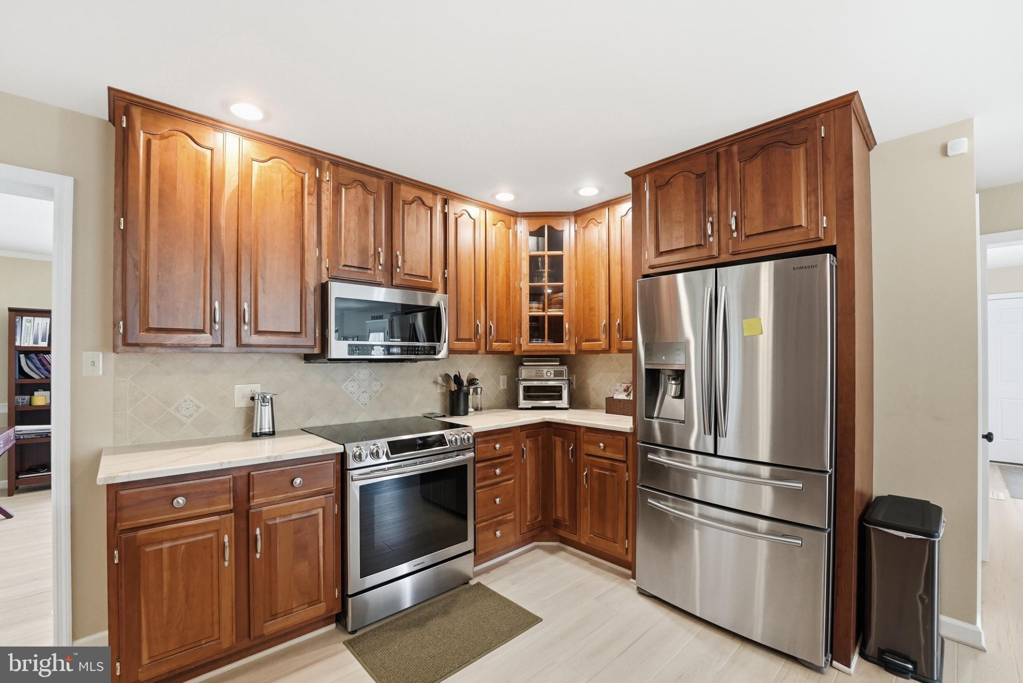 11337 Old Stillhouse Road Boston, VA 22713 - Photo 25 of 58 a kitchen with stainless steel appliances granite countertop a refrigerator stove and microwave