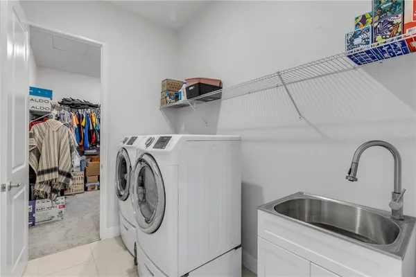 a view of storage and utility room with washer and dryer