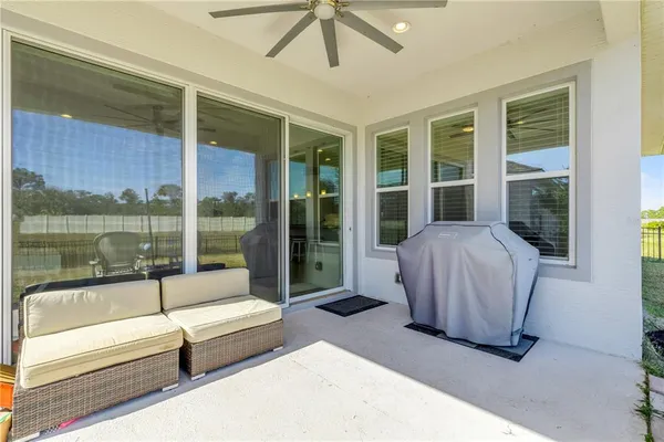 a spacious bedroom with a large tub and glass door