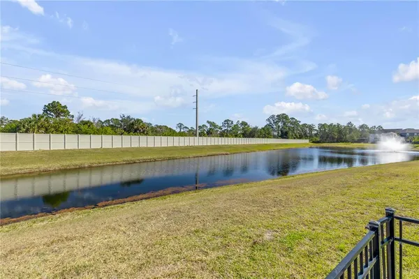a view of a lake with a big yard