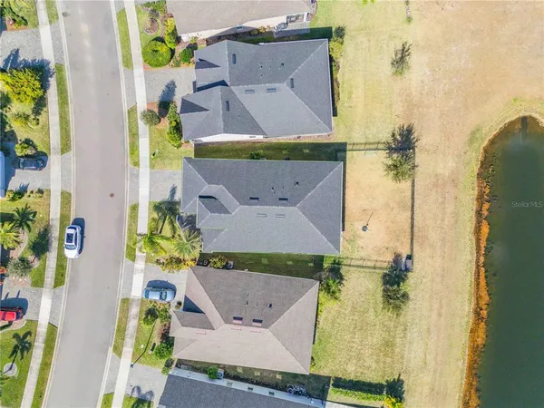 an aerial view of a house with a swimming pool