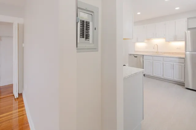 a bathroom with a sink vanity and mirror