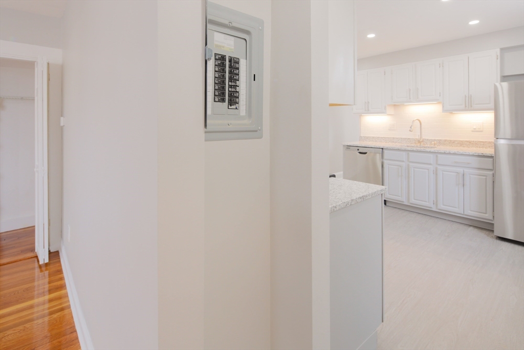 259 Calvary Street, Unit 1 Waltham, MA 02453 - Photo 19 of 27 a bathroom with a sink vanity and mirror