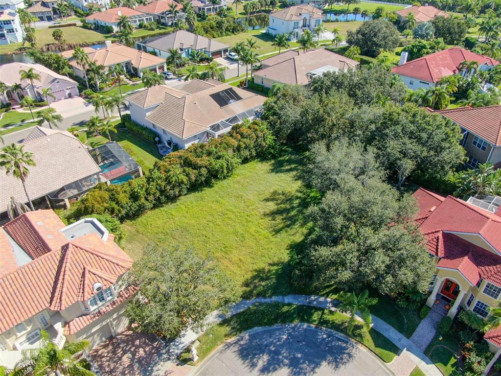 5913 La Rosa Lane Apollo Beach, FL 33572 - Photo 1 of 10 an aerial view of residential houses with outdoor space