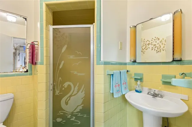 a view of a porch with furniture and garden