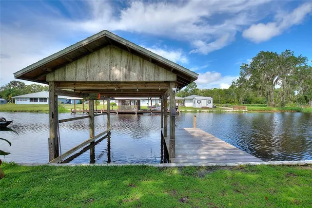 a view of a swimming pool with a yard