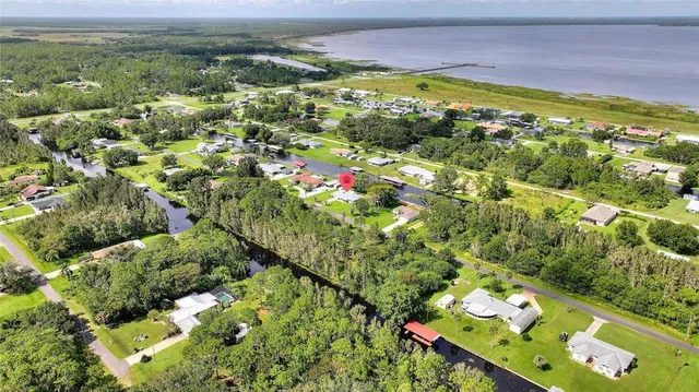 a view of a lake with a house in the background