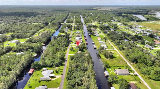 an aerial view of a houses with outdoor space